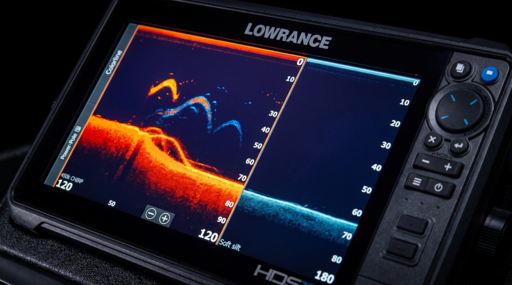 Lowrance HDS sonar unit displaying dual frequency 2D CHIRP and DownScan split screen on boat dashboard
