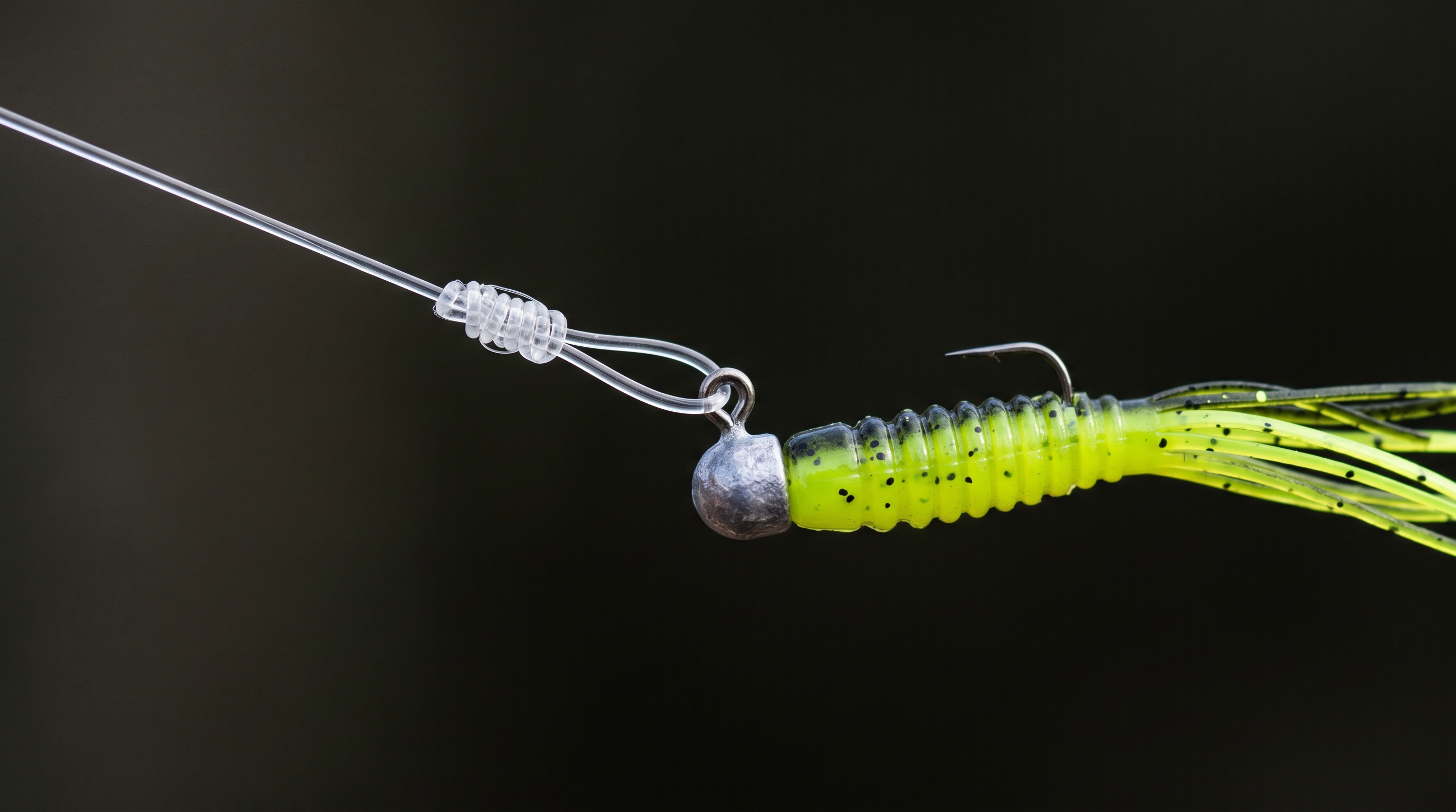 Macro photography of 1/32 oz crappie jig rigged on non-slip loop knot